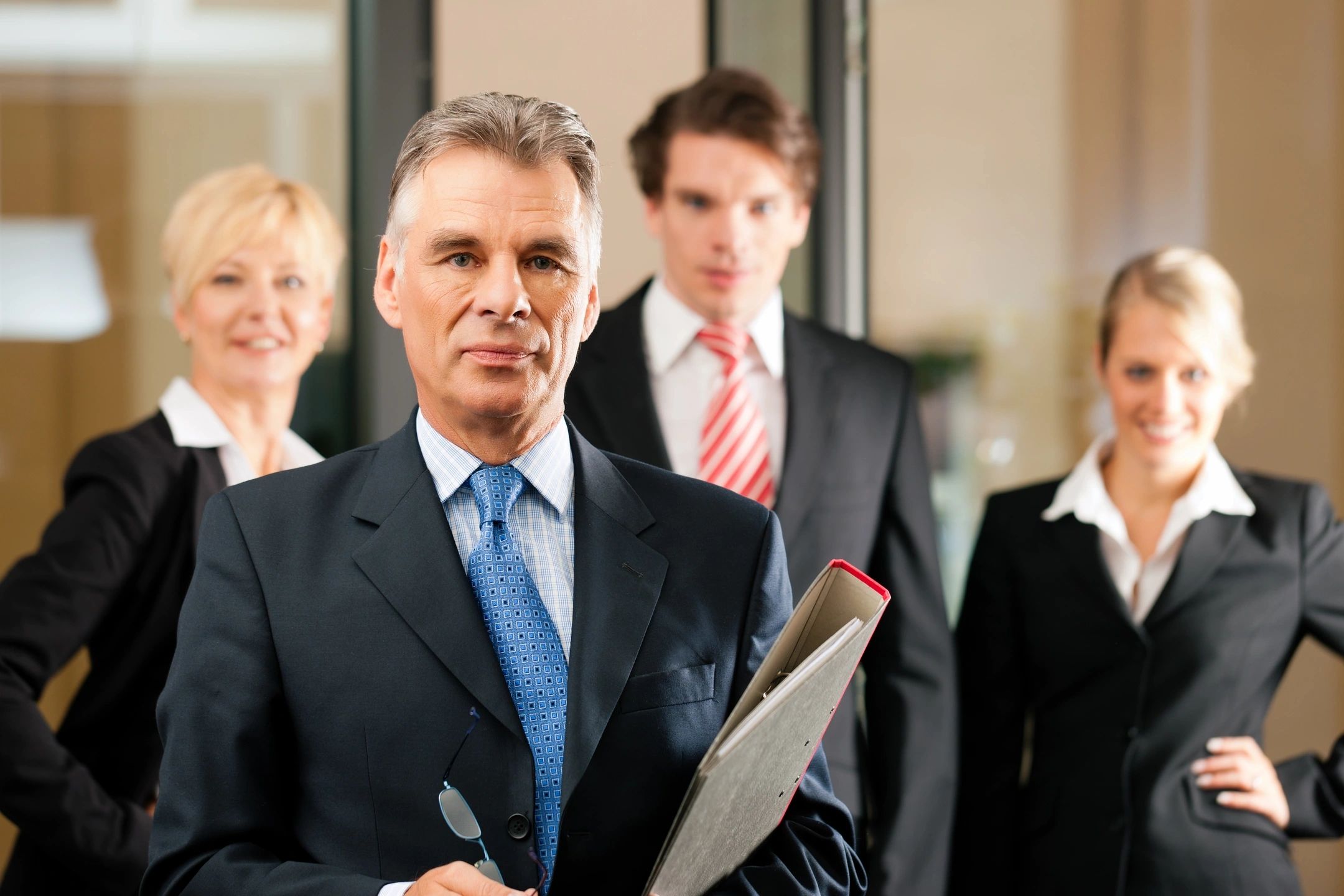 Four Lawyers standing looking at camera